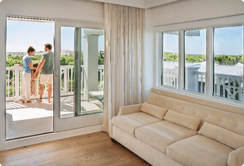 Couple on the balcony of their hotel room in Avalon at the ICONA Windrift hotel