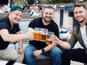 Friends toasting with beer at Oktoberfest in Avalon