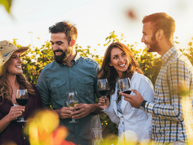 Friends sharing a glass of wine in a winery in Cape May