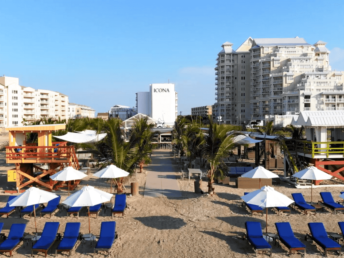 View of sun loungers with beach umbrellas by ICONA Diamond