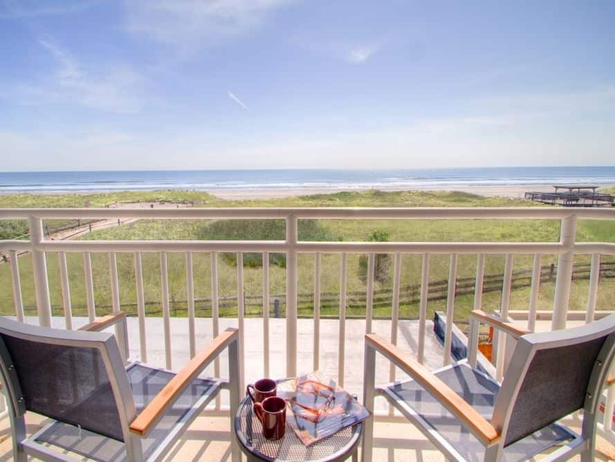 Balcony lounge with a beach view at ICONA Avalon Resort