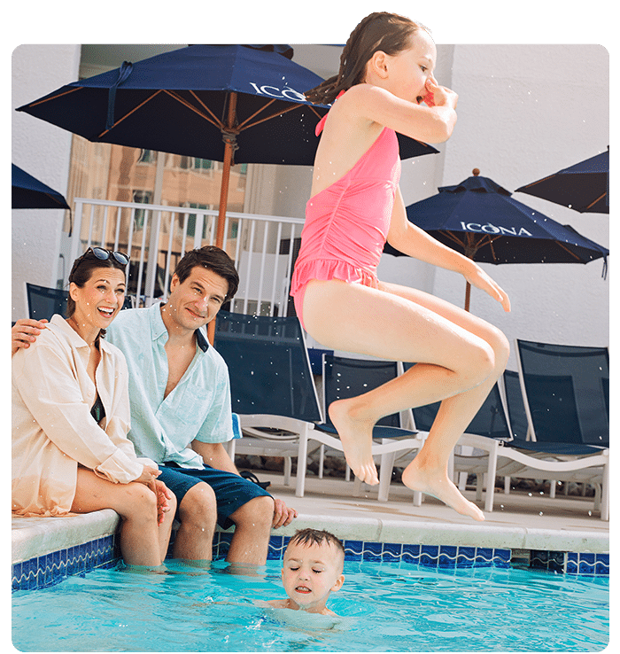 Child jumping into the pool at ICONA Cape May