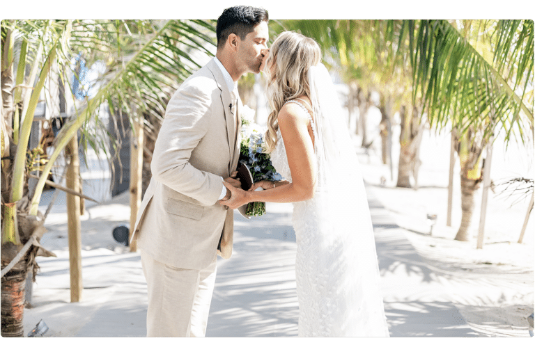 Bride and groom kissing at an ICONA Diamond Beach wedding in NJ