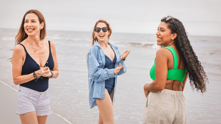 Three friends smiling on Diamond Beach