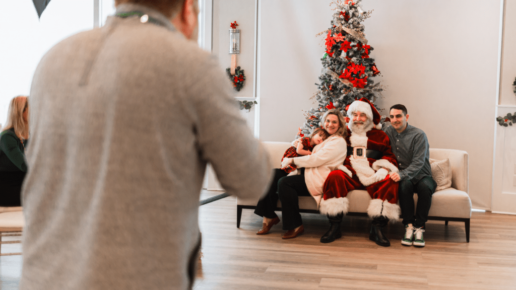 Family taking a photo with Santa Clause